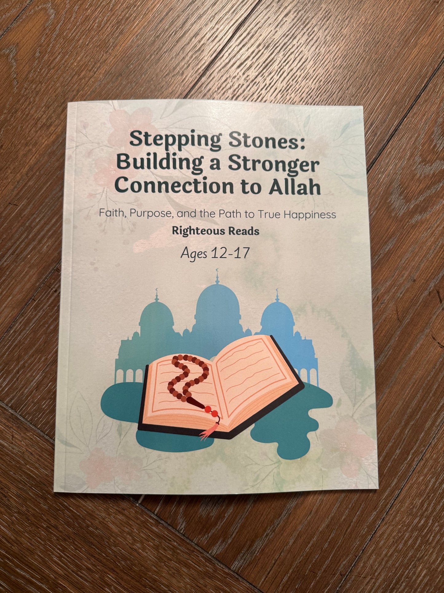 Book cover placed on a wooden table